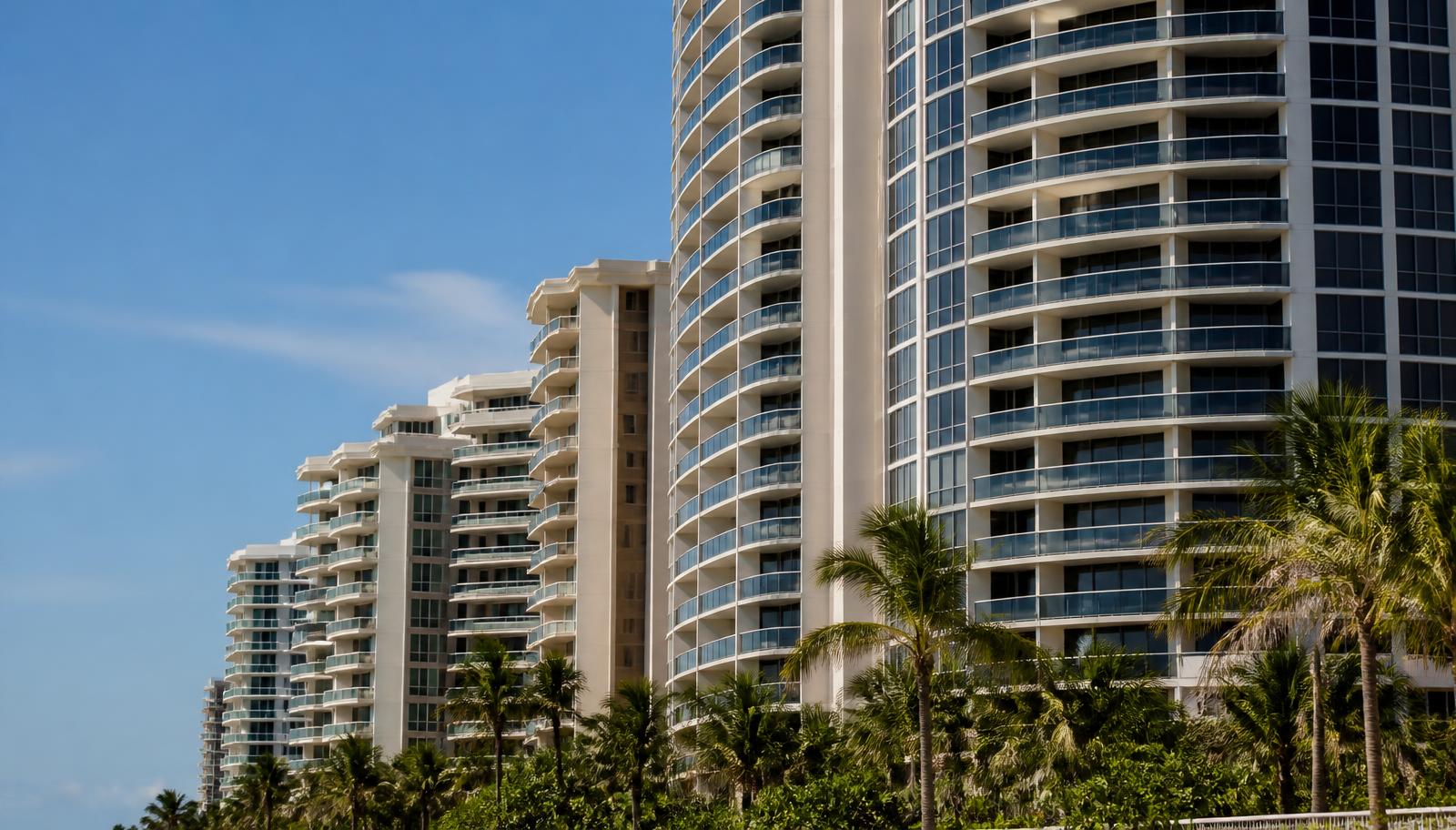 Florida oceanfront condominium towers with balconies along the coast